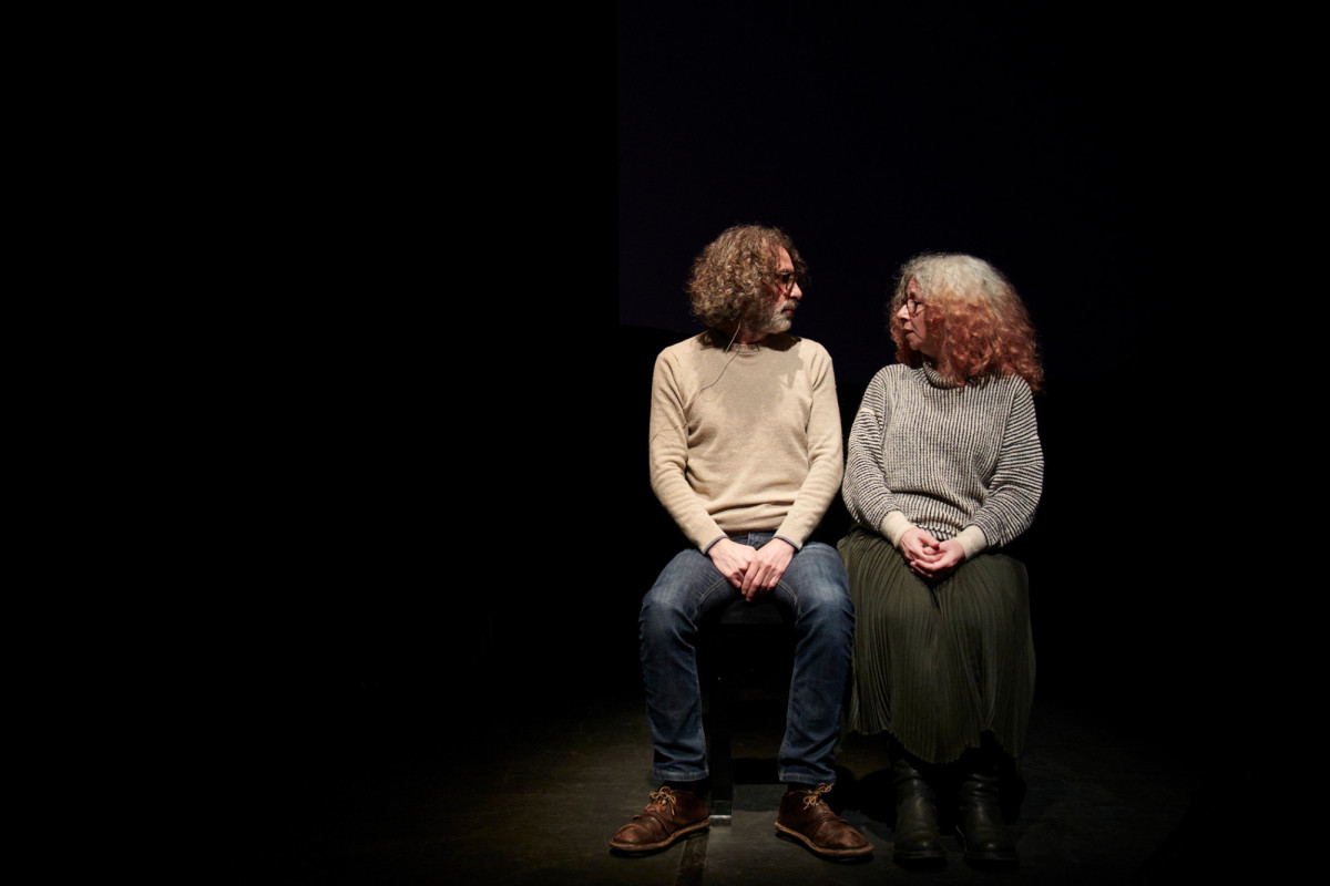 Lina Majdalanie and Rabih Mrou&eacute; sit on the edge of the stage facing each other.