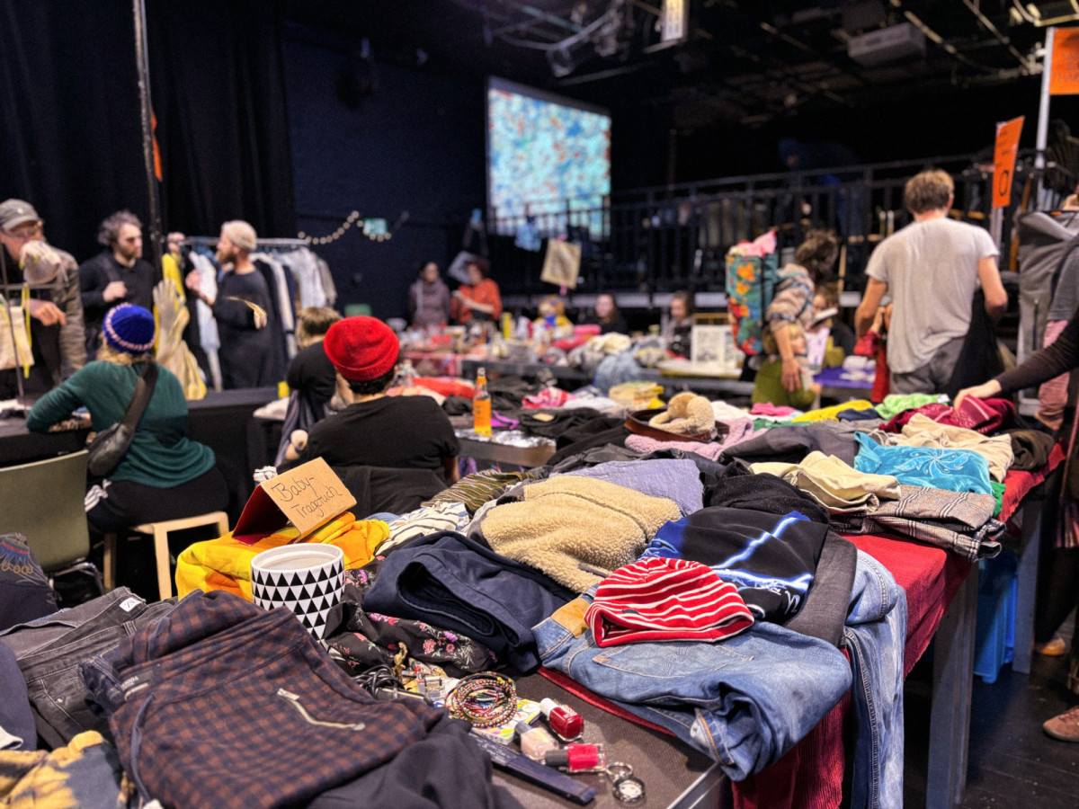 A landscape of colorful flea market stalls in the hall of the Schwankhalle
